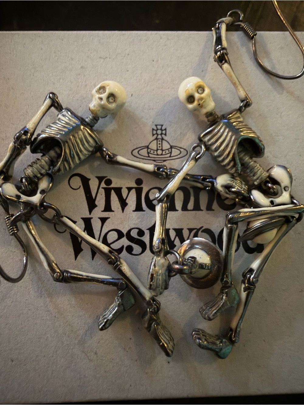RARE bone enamel skeleton earrings- box, dust bag and auth. card included